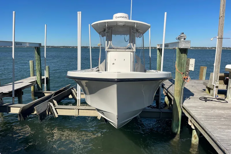  Yacht Photos Pics 2023 Pair Customs 24 Center Console DV boat docked on a sunny day.
