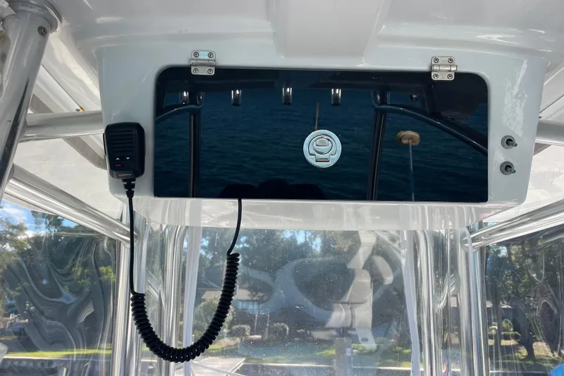  Yacht Photos Pics 2023 Pair Customs 24 Center Console DV boat dashboard with radio and reflective panel.