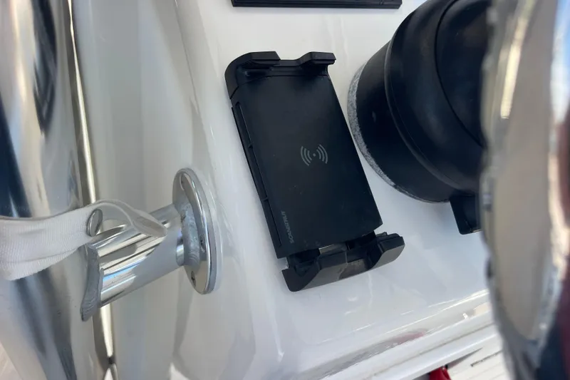  Yacht Photos Pics Close-up of 2023 Pair Customs 24 Center Console DV dashboard with phone holder and steering wheel.