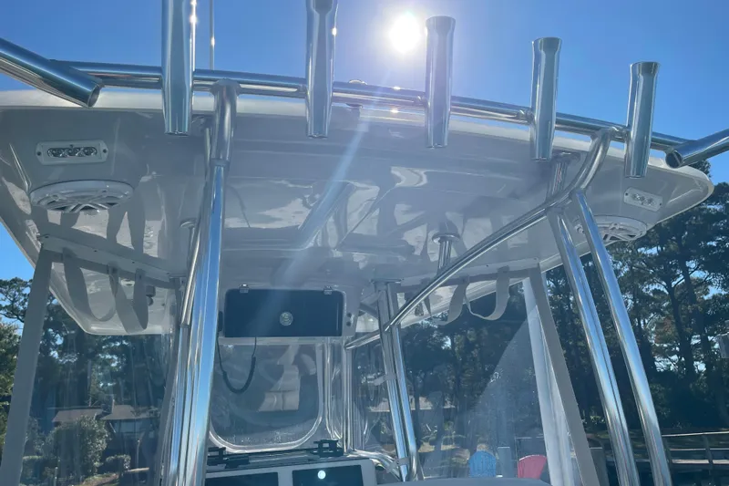  Yacht Photos Pics 2023 Pair Customs 24 Center Console DV boat with stainless steel T-top under sunny sky.