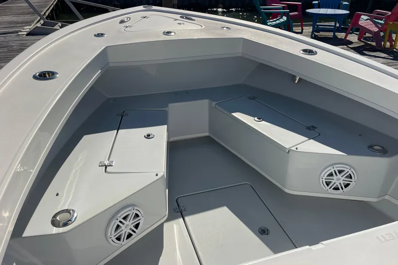  Yacht Photos Pics 2023 Pair Customs 24 Center Console DV boat interior with seating and storage compartments.