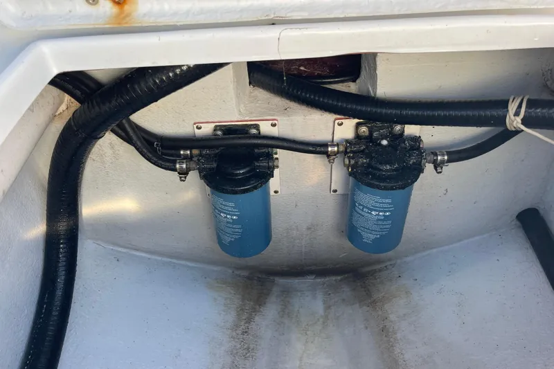  Yacht Photos Pics 2023 Pair Customs 24 Center Console DV boat engine compartment with dual filters and hoses.
