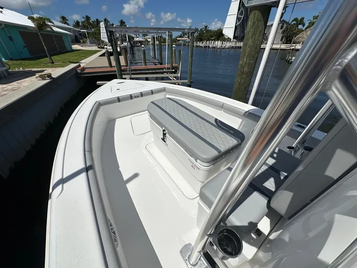  Yacht Photos Pics 2024 Lake & Bay 25 Open boat docked by a waterfront home.