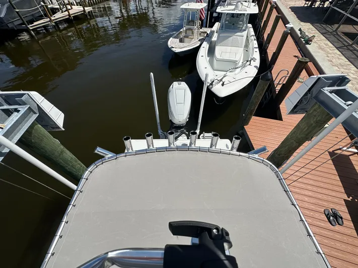  Yacht Photos Pics 2024 Lake & Bay 25 Open boat docked at marina, aerial view.