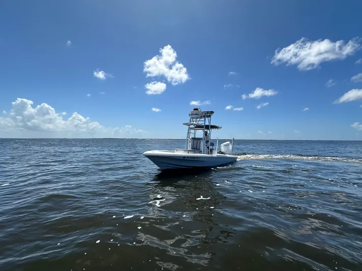  Yacht Photos Pics 2024 Lake & Bay 25 Open boat cruising on a sunny day.