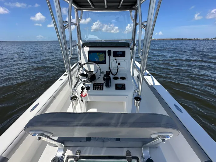  Yacht Photos Pics 2024 Lake & Bay 25 Open boat interior with steering console on open water.