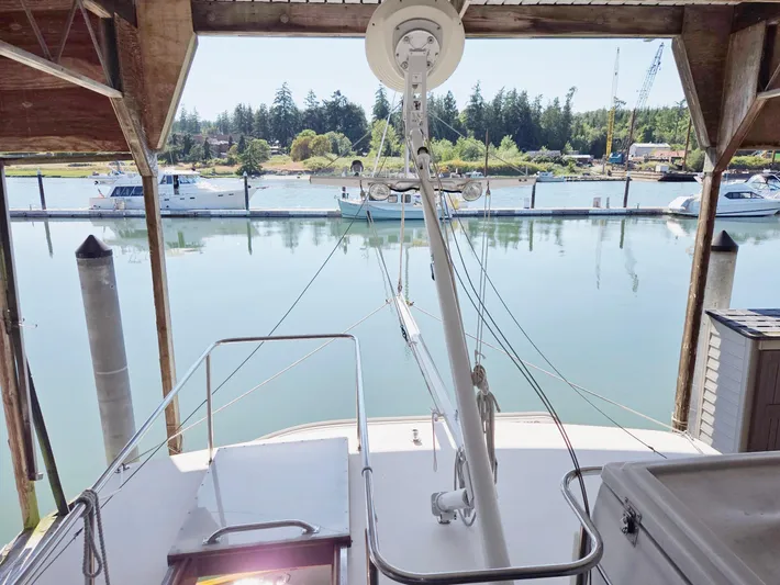 Carina Yacht Photos Pics 1990 Grand Banks 36 Europa docked in a serene marina setting.
