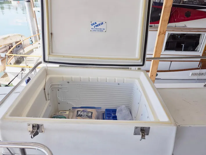 Carina Yacht Photos Pics Open freezer on 1990 Grand Banks 36 Europa yacht, containing food and ice packs.