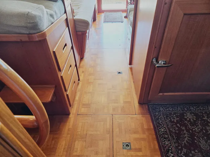 Carina Yacht Photos Pics Interior of 1990 Grand Banks 36 Europa yacht with wooden flooring and cabinetry.