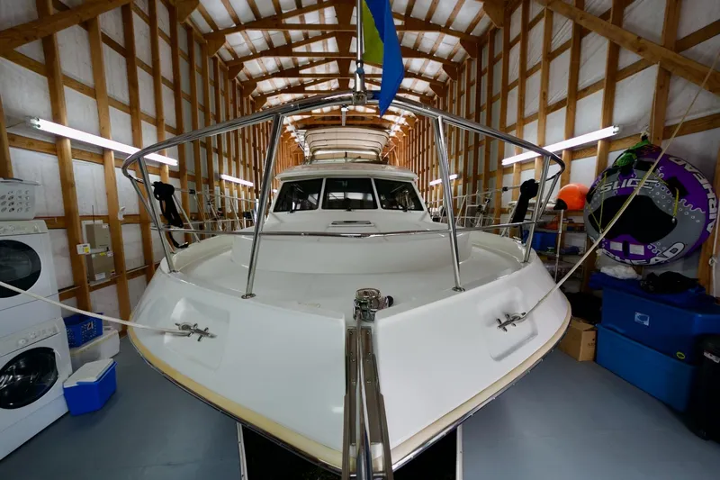 Nautilus Yacht Photos Pics 2008 Navigator 5100 yacht in storage, surrounded by equipment and supplies.