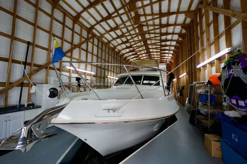 Nautilus Yacht Photos Pics 2008 Navigator 5100 yacht stored in a wooden boathouse with various equipment.