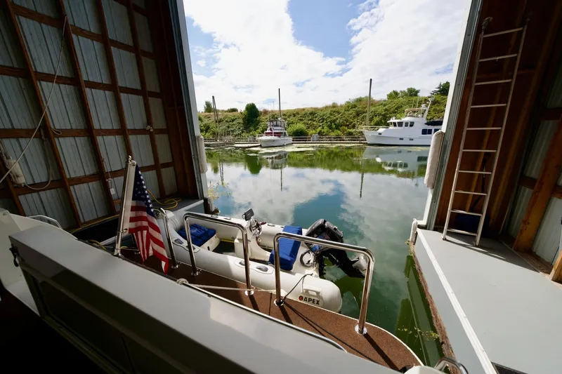 Nautilus Yacht Photos Pics Boathouse view with docked boats, featuring a 2008 Navigator 5100.