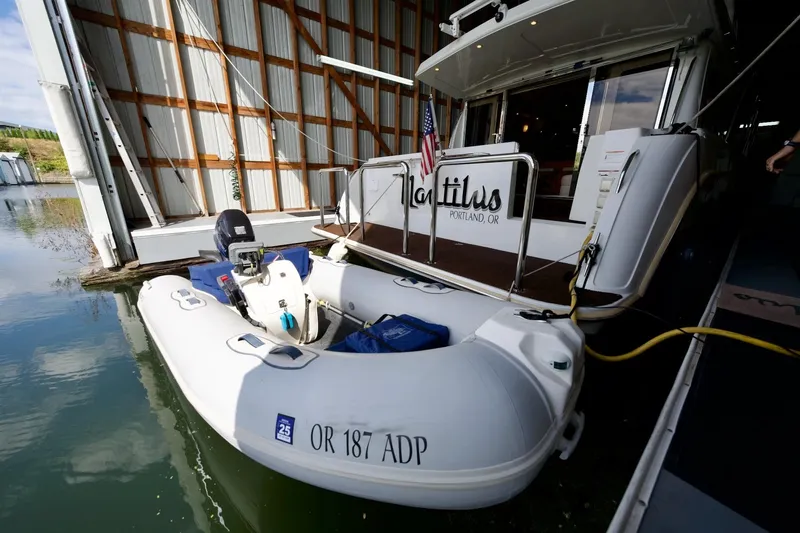 Nautilus Yacht Photos Pics 2008 Navigator 5100 yacht with inflatable boat docked in Portland, Oregon.