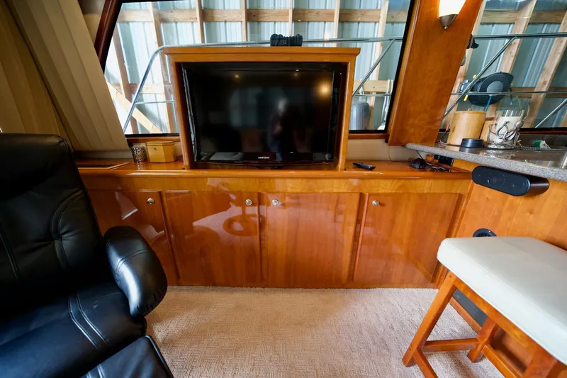 Nautilus Yacht Photos Pics Luxurious interior of 2008 Navigator 5100 yacht with TV and leather seating.