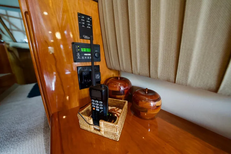 Nautilus Yacht Photos Pics Interior of 2008 Navigator 5100 yacht with communication equipment and wooden decor.