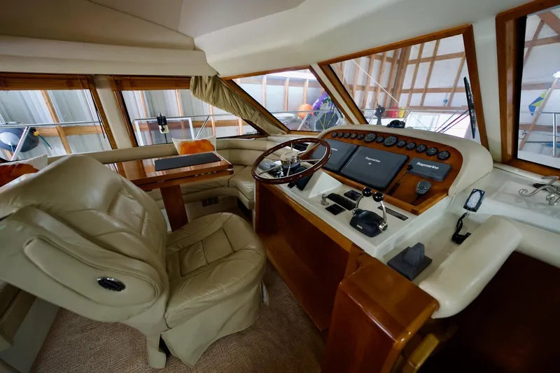 Nautilus Yacht Photos Pics Luxurious 2008 Navigator 5100 yacht interior with leather seating and advanced navigation controls.