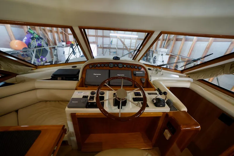 Nautilus Yacht Photos Pics 2008 Navigator 5100 yacht helm with steering wheel and navigation controls.
