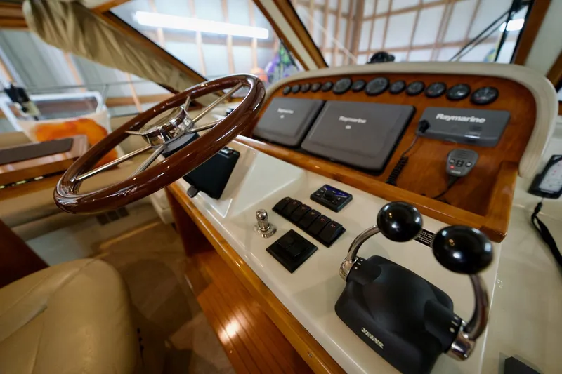 Nautilus Yacht Photos Pics Steering console of 2008 Navigator 5100 yacht with Raymarine navigation equipment.