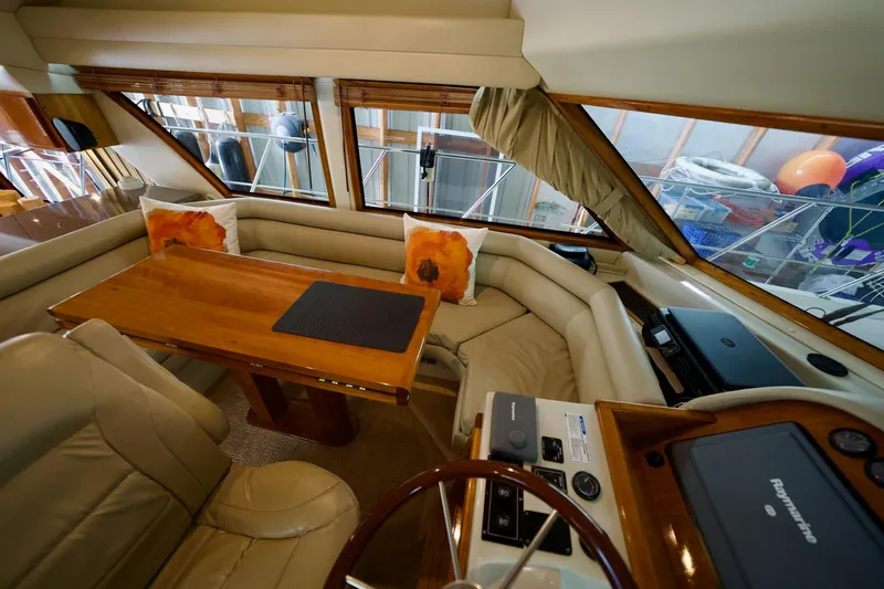 Nautilus Yacht Photos Pics Luxurious interior of 2008 Navigator 5100 yacht with leather seating and wooden table.