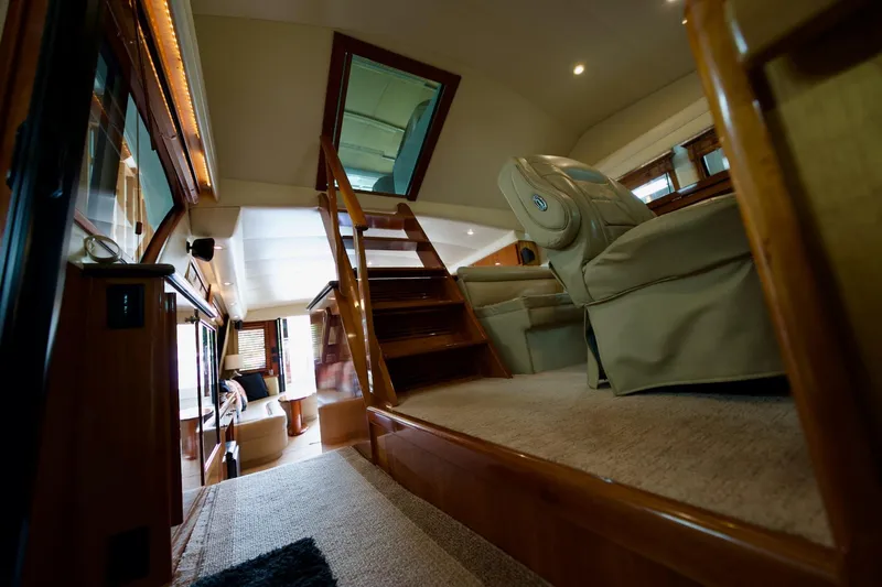 Nautilus Yacht Photos Pics Interior of 2008 Navigator 5100 yacht with luxurious seating and wooden accents.