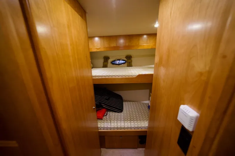 Nautilus Yacht Photos Pics Bunk beds in 2008 Navigator 5100 yacht cabin with wooden interior.
