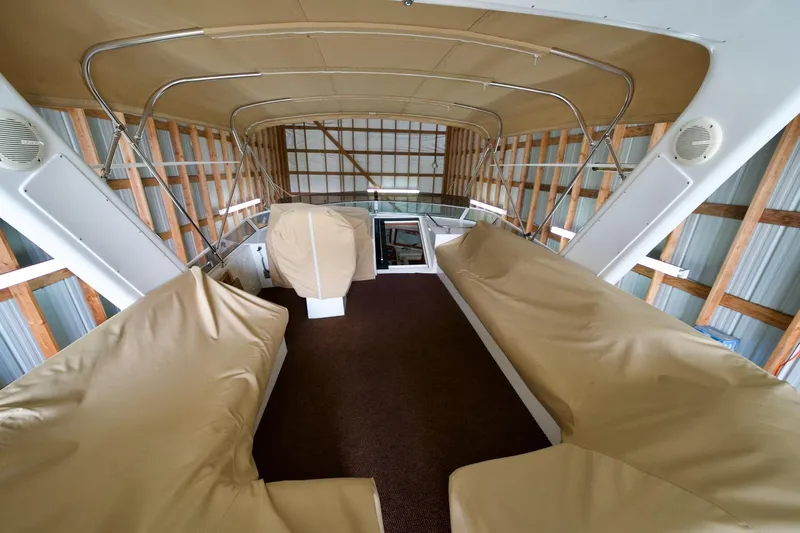 Nautilus Yacht Photos Pics Interior view of 2008 Navigator 5100 yacht with covered seating and wooden framework.