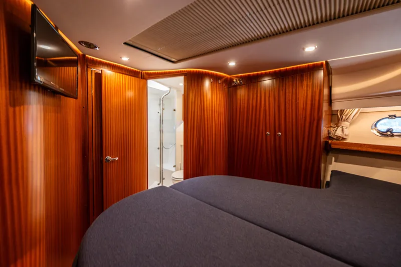  Yacht Photos Pics Luxurious interior of 2021 Nimbus 405 Coupé yacht with wood paneling and modern amenities.