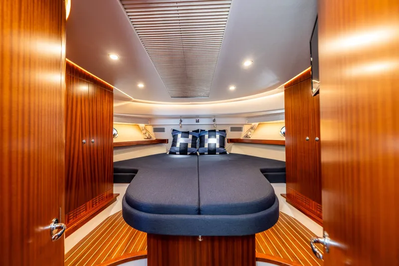  Yacht Photos Pics Luxurious cabin interior of 2021 Nimbus 405 Coupé yacht with elegant wood finish.