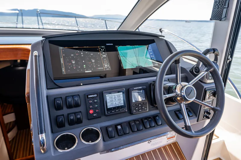  Yacht Photos Pics Cockpit of 2021 Nimbus 405 Coupé #88 with advanced navigation controls and steering wheel.