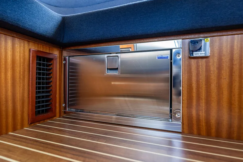  Yacht Photos Pics Interior of 2021 Nimbus 405 Coupé, featuring a stainless steel appliance and wooden finish.