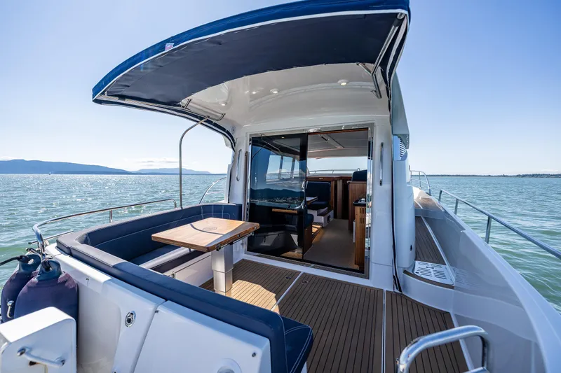  Yacht Photos Pics Nimbus 405 Coupé #88, 2021 model, luxury yacht interior with open deck and scenic ocean view.