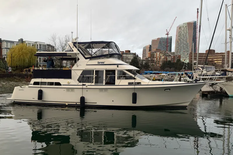 "sarona Ii" Yacht Photos Pics 1994 Tollycraft 45 Cockpit Motor Yacht docked in urban marina setting.