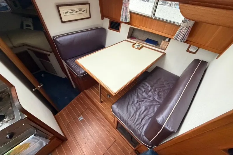 "sarona Ii" Yacht Photos Pics Interior of 1994 Tollycraft 45 Cockpit Motor Yacht with dining area and leather seating.
