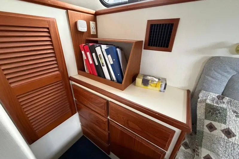 "sarona Ii" Yacht Photos Pics 1994 Tollycraft 45 Cockpit Motor Yacht interior with wood cabinetry and storage.