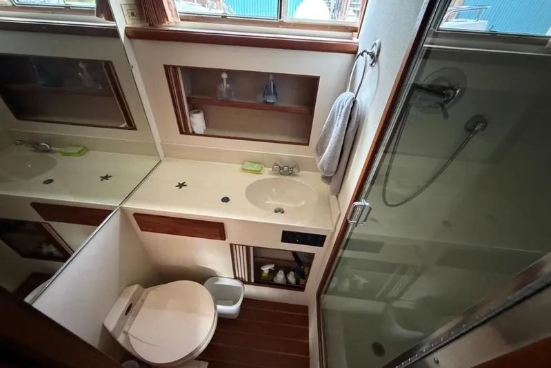 "sarona Ii" Yacht Photos Pics Bathroom interior of 1994 Tollycraft 45 Cockpit Motor Yacht with shower and sink.