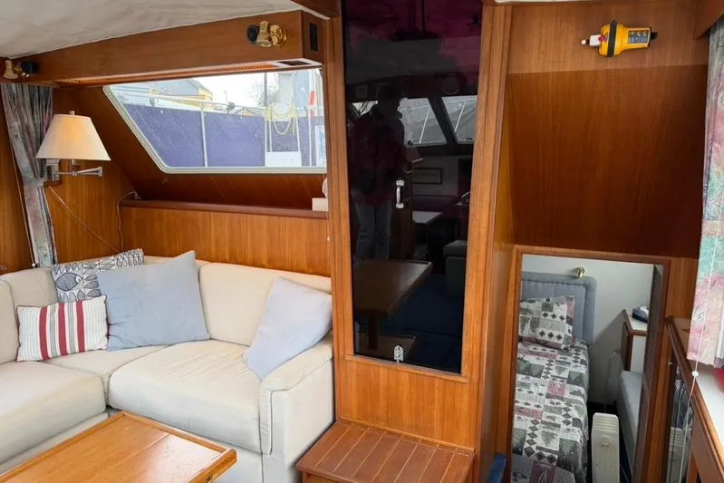 "sarona Ii" Yacht Photos Pics Interior of 1994 Tollycraft 45 Cockpit Motor Yacht with cozy seating and wood paneling.