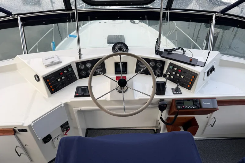 "sarona Ii" Yacht Photos Pics Cockpit of 1994 Tollycraft 45 Cockpit Motor Yacht with steering wheel and control panels.