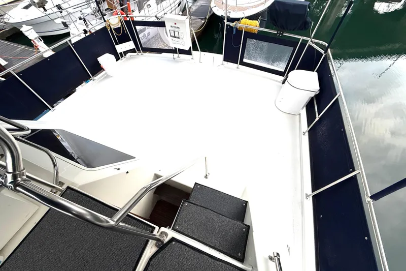 "sarona Ii" Yacht Photos Pics 1994 Tollycraft 45 Cockpit Motor Yacht deck with railing and marina view.