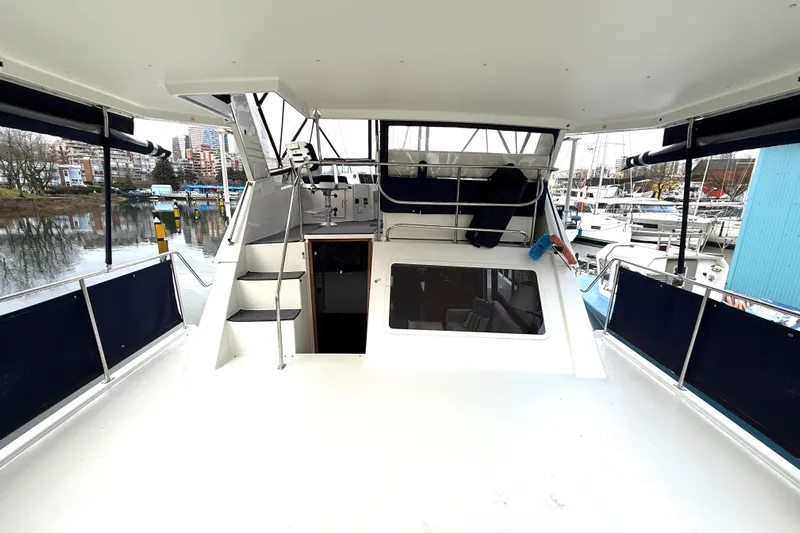 "sarona Ii" Yacht Photos Pics 1994 Tollycraft 45 Cockpit Motor Yacht docked at marina, featuring spacious deck and helm.