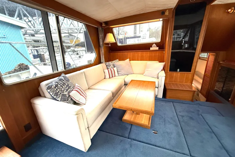 "sarona Ii" Yacht Photos Pics Interior of 1994 Tollycraft 45 Cockpit Motor Yacht with cozy seating and wooden table.