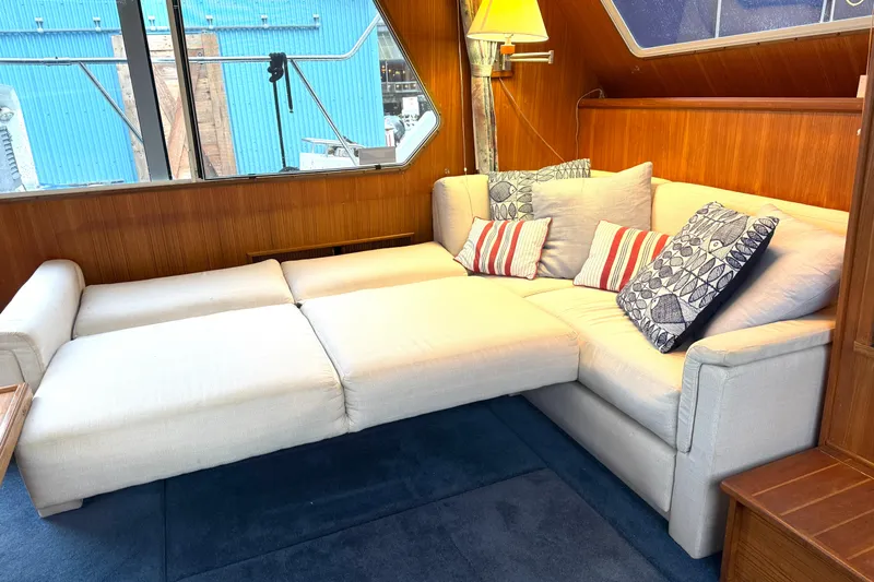 "sarona Ii" Yacht Photos Pics Interior of 1994 Tollycraft 45 Yacht with cozy white sofa and decorative pillows.