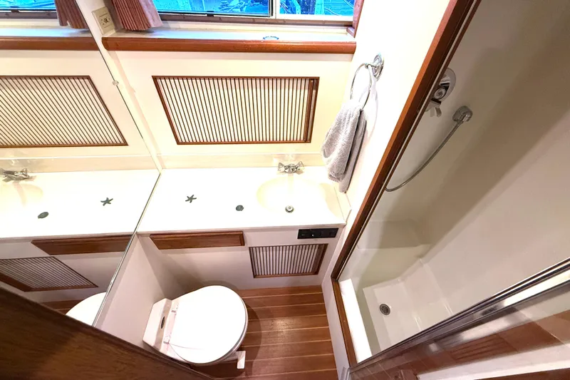 "sarona Ii" Yacht Photos Pics Bathroom interior of 1994 Tollycraft 45 Cockpit Motor Yacht with shower and sink.
