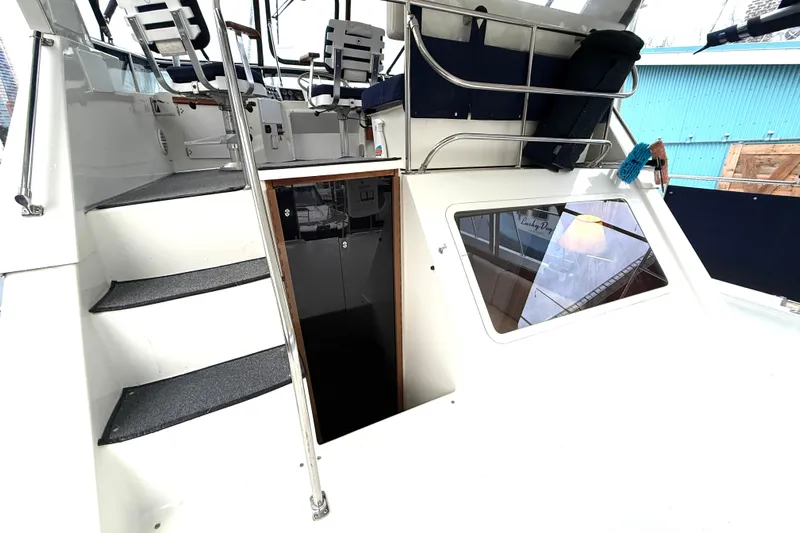 "sarona Ii" Yacht Photos Pics 1994 Tollycraft 45 Cockpit Motor Yacht interior with stairs and seating area.