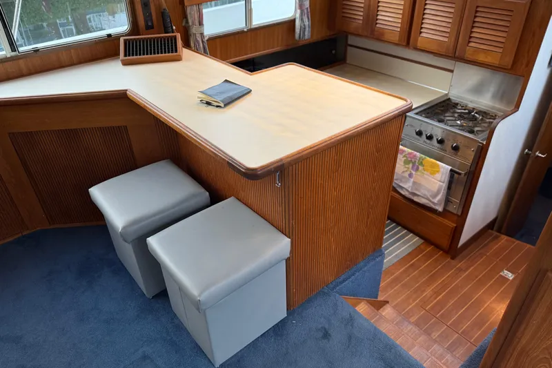 "sarona Ii" Yacht Photos Pics Interior of 1994 Tollycraft 45 Cockpit Motor Yacht with kitchen and seating area.