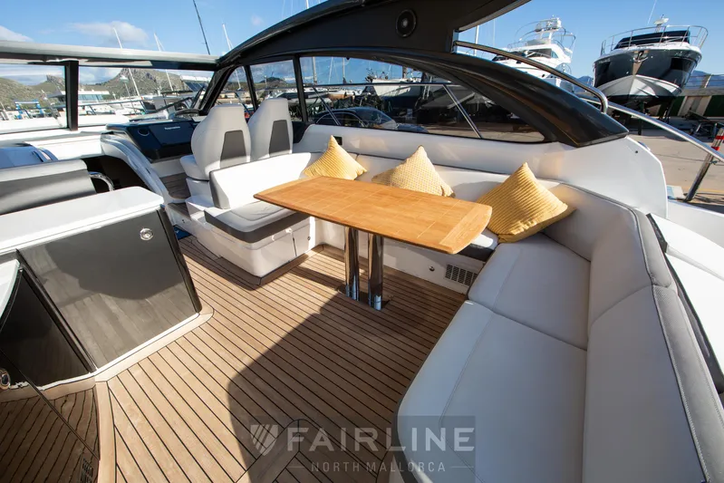  Yacht Photos Pics Luxurious 2017 Princess V48 Open yacht interior with elegant seating and wooden table.