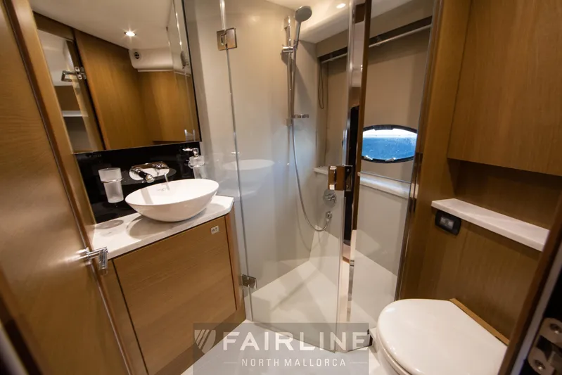  Yacht Photos Pics Luxurious bathroom in 2017 Princess V48 Open yacht with modern fixtures and wooden cabinetry.