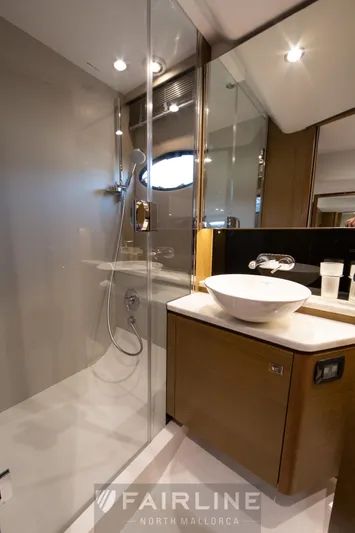  Yacht Photos Pics Luxurious bathroom in 2017 Princess V48 Open yacht with modern fixtures and glass shower.