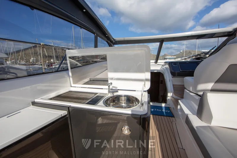  Yacht Photos Pics 2017 Princess V48 Open yacht interior with kitchenette and seating area.