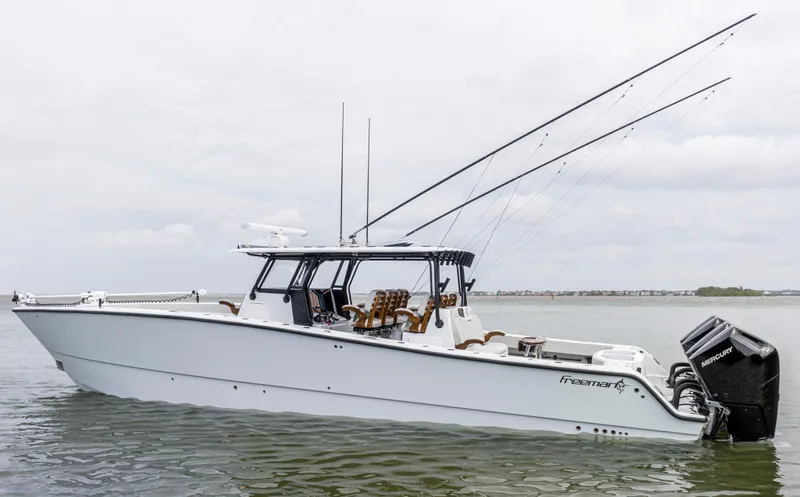  Yacht Photos Pics 2024 Freeman 42 LR boat on water with fishing rods and outboard motors.