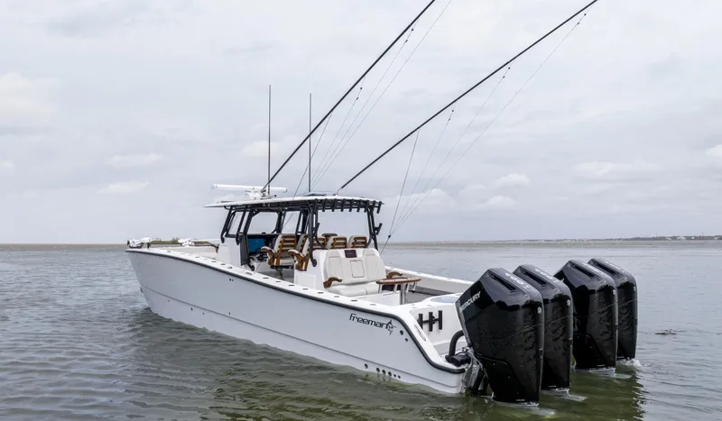 Yacht Photos Pics 2024 Freeman 42 LR boat with four outboard motors on the water.